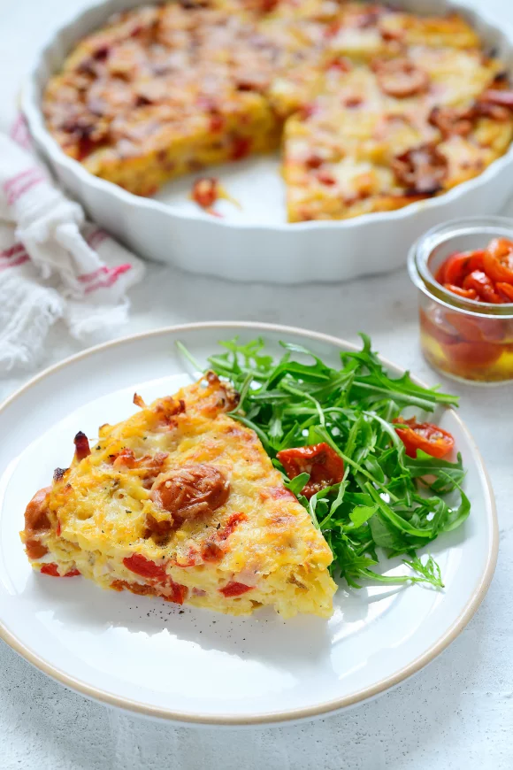 Aardappeltaart met spek en zongedroogde tomaatjes