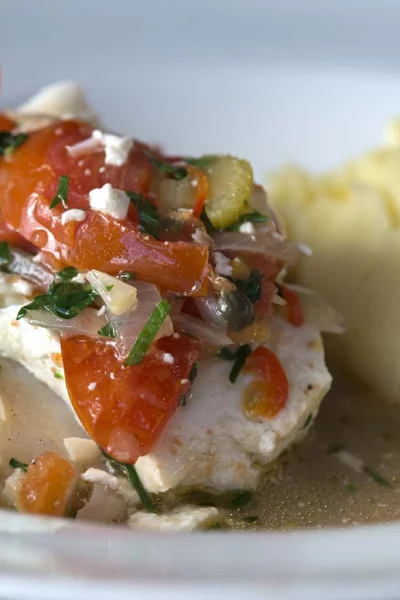 Kabeljauw uit de oven met tomaat en polderpuree